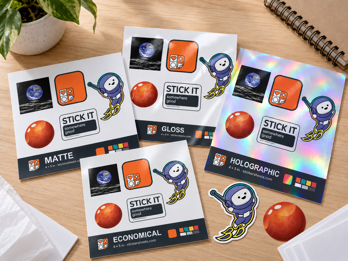 The sticker sample pack: matte, gloss, economical and holographic 4 x 5 inch sheets with a die-cut Mars and a kiss-cut astro single